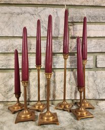 Vintage Set Of (7) Graduated Metal Candle Holders With Red Candles Included.