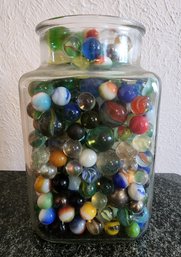 Large Variety Of Marbles In Clear Container