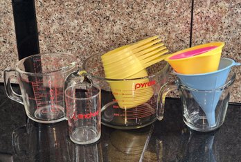 Variety Of Measuring Cup Selections And Funnels