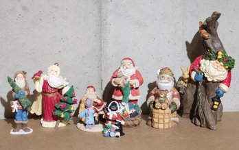 Assortment Of Santa Claus And Christmas Theme Figures