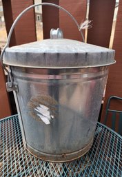 Galvanized Metal Bucket With Bird Seed At Bottom