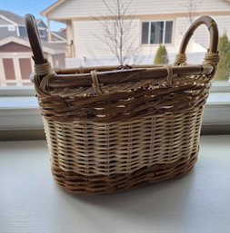 Basket With Handles And Pine Cone Decor