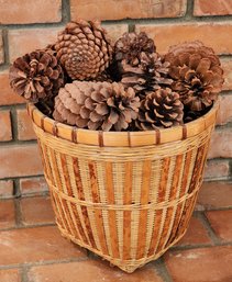 Vintage Woven Basket Filled With Pinecones