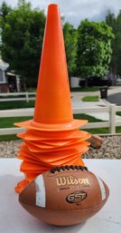 Group Of Orange Pylons And Youth Size Football