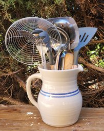 Assortment Of Kitchen Essential Utensils With Ceramic Pitcher