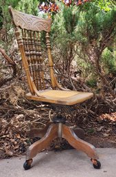 Antique Wooden Bankers Chair With Spindle Back And Cane Seat Accent