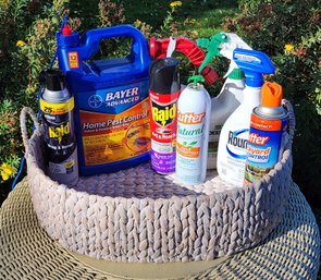 Assortment Of Home Pest Control Chemical Products With Storage Basket