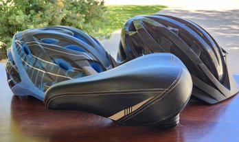 Bicycle Essentials - (2) Helmets And (1) Padded Seat