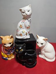 Four Cat Figurines