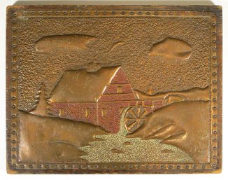 ANTIQUE ARTS & CRAFTS PUNCHED COPPER AND POLYCHROME PLAQUE OF A MILL SCENE, EARLY 20TH CENTURY