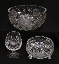 THREE VINTAGE PIECES OF CUT GLASS, INCLUDING A PEONIES AND BUTTERFLIES BOWL AND WATERFORD SNIFTER