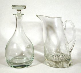 TWO CLEAR GLASS SERVING PIECES, INCLUDING A SCHOTT ZWEISEL PITCHER AND STOPPERED DECANTER