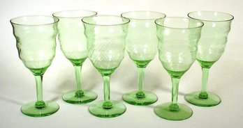 SET OF SIX GREEN SWIRLED OPTIC DEPRESSION GLASS WINE GLASSES, 1920s - 1930s