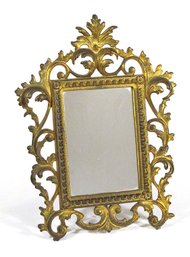 ANTIQUE GILDED CAST IRON PICTURE FRAME/MIRROR IN THE BAROQUE TASTE, LATE 19TH CENTURY