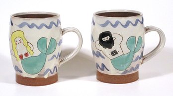 PAIR OF MERMAID/MERMAN-THEMED STUDIO POTTERY COFFEE MUGS BY BETHANY BUTTERWORTH, NOVA SCOTIA, CONTEMPORARY