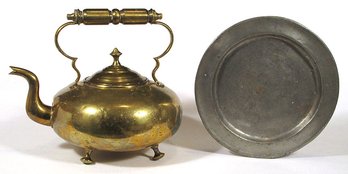 TWO ANTIQUE METAL OBJECTS, INCLUDING A PEWTER PLATE AND SOLID BRASS TEAKETTLE