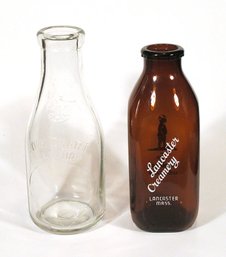 TWO VINTAGE QUART MILK BOTTLES, INCUDING AMBER PYRO, EARLY-TO-MID 20TH CENTURY