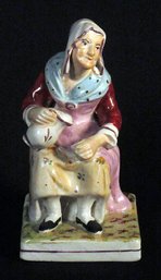 ANTIQUE STAFFORDSHIRE FIGURE OF 'NELL,' CIRCA 1840