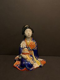 Figure Of Geisha Holding A Puppy, Japan Circa 1920