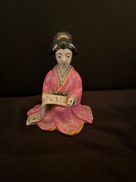 Seated Geisha Figurine Reading Scroll