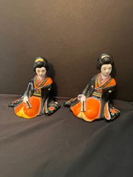 Pair Of Porcelain Seated Geisha Figu