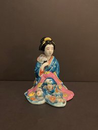 Japanese Porcelain Figurine Of A Seated Geisha