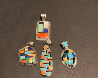 Four Sterling Silver And Mixed Stone Pendants