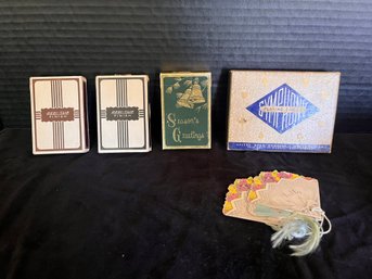 Four Decks Of Playing Cards And Three Tallies
