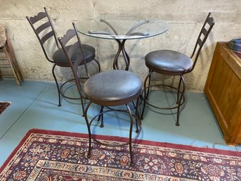 Glass Table And Three Metal Swivel Chairs