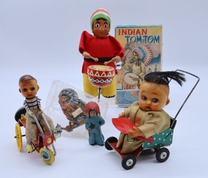 VINTAGE TOY COLLECTION DOLLS ON BICYCLE AND AMERICAN INDIANS
