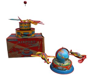 Two Vintage Wind-Up Airplane Toys