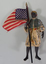 Metal Statue Of Man Holding Flag
