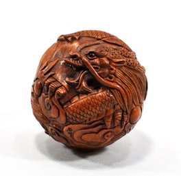 Antique Japanese  Carved Boxwood Dragon Ball Figurine
