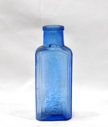 Antique Keasbey & Mattison Co Blue Glass Embossed Bottle