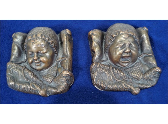 2 Bronze Baby Head Paperweights