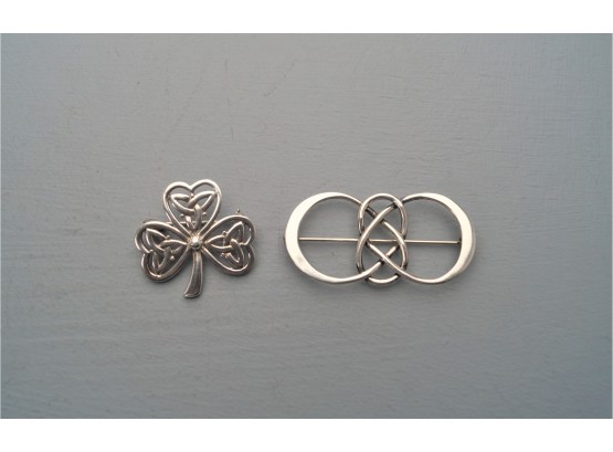 Two Sterling Silver Pins.