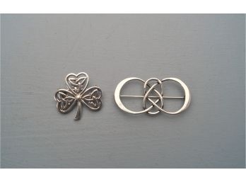 Two Sterling Silver Pins.