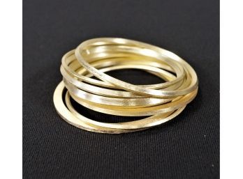 Stack Of Gold Tone Bangles