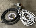 (3) Assorted Size Hoses With (2) Nozzles And A Watering Can