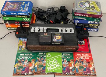 Vintage Atari 2600 With (14) Games, Controllers, Paddles, And Catalogs