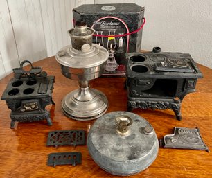 (2) Antique Crescent Miniature Cast Iron Stoves (as Is) Aladdin Silver Tone Oil Lamp, And Bordeaux Oil Lamps