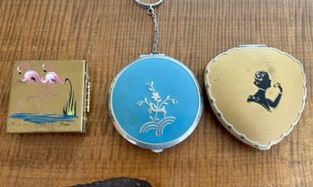 (2) Vintage Compacts And A Vintage Brass Miniature Folding Picture Frame With Enamel Flamingos