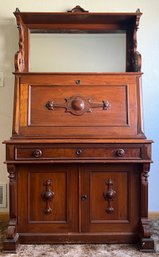 Antique Solid Walnut Hand Carved Drop Front Desk With Burl Walnut Drawers, Mirrored Back, Felt Top, And Key