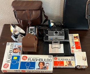 Camera Lot - Kodak Duaflex II And Polaroid Automatic 100 With Cases, Flashes, And Flash Bulbs