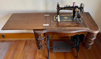 Antique Windsor Treadle Sewing Machine By Montgomery Ward With Tiger Oak 6-drawn Base And Glass Top