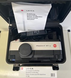 Leica Pradovit RT-s Slide Projector With Hard Case, 80 Slide Round Tray, Remote, Lens, Power Cable, And Manual