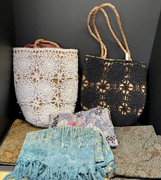 (2) Black And White Hand Crocheted Woven Ratan Bags, (4) Material Balinese Sarongs And Skirt
