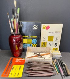 Assorted Calligraphy Pens, Nibs, Paint Brushes, Speed Ball Text Books, And Japan Vase