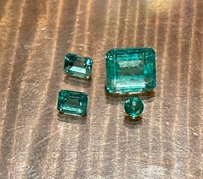3 Emerald Cut Loose Emeralds And 1 Round Faceted Emerald  - Total Carats 3