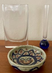 Controlled Bubble Cobalt Art Glass Bud Vase, Pottery Sun Face Bowl, And Clear Glass Vase